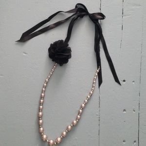 Faux pink pearl necklace with black ribbon